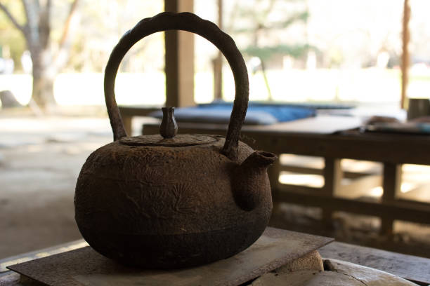 A beautiful old metal kettle for boiling water on fire