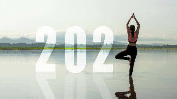 happy new year start up 2021.  yoga women lifestyle exercise and pose for healthy life. people balance body vital zen and meditation for workout sunrise morning nature background for success 2012. health care concept - condition optimal text healthy lifestyle imagens e fotografias de stock