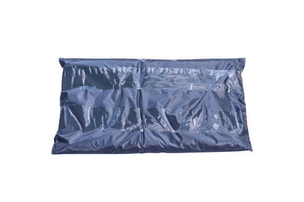 istock Black polythene envelope packaging closed with tape, isolated on white background clipping path , online purchase and delivery 1283673877