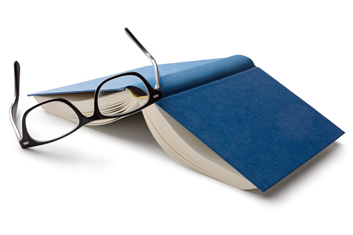 Office: Book and Reading Glasses Isolated on White Background