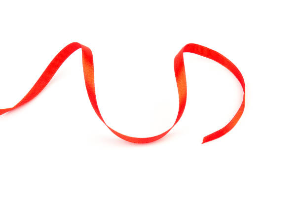 istock Top view of Red ribbon isolated shiny rolled on white background. Flat lay view. 1283674408