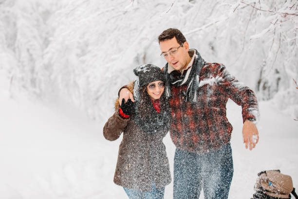istock Playful couple on snow 1283674623