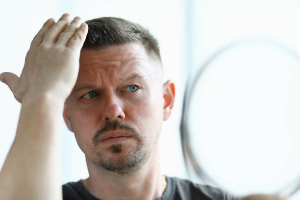 istock Man makes his hair with gel closeup 1283675099