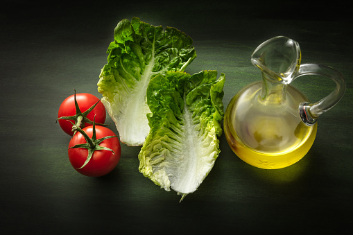 Salads: Romaine Lettuce, Tomato and Olive Oil Still Life