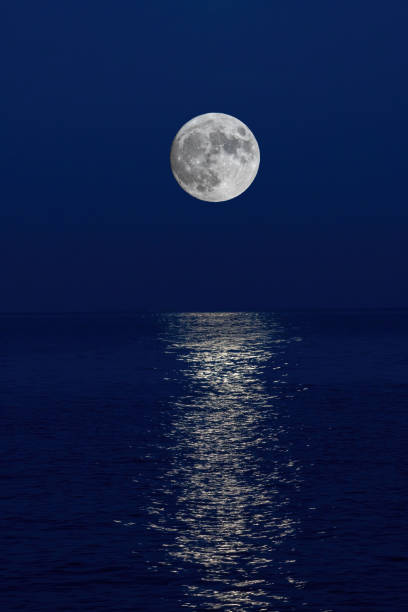 istock Full moon reflection over the evening sea in Spanish Costa Brava 1283676226