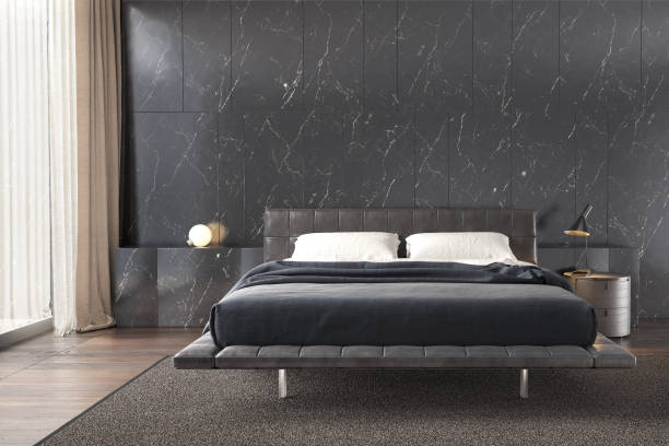 istock Bedroom interior with black marble wall pattern , side table lamp and wooden floor.3D illustration 1283676633