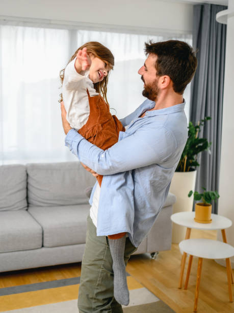 istock Happy dad and daughter dance have fun at home 1283676790