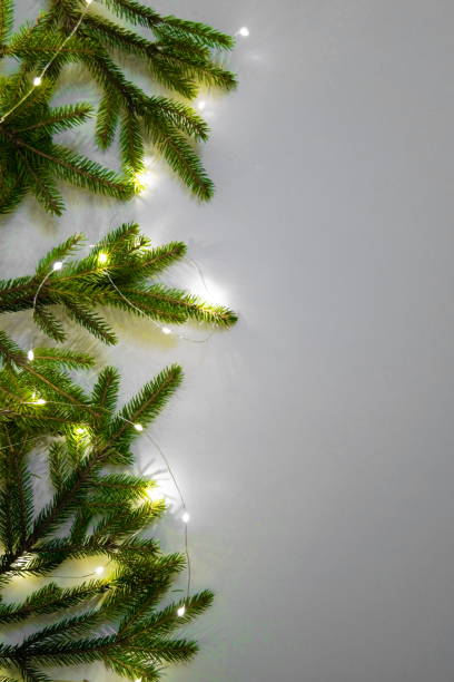 istock Christmas tree branches decorated before Christmas and New Year with glowing garlands 1283677023