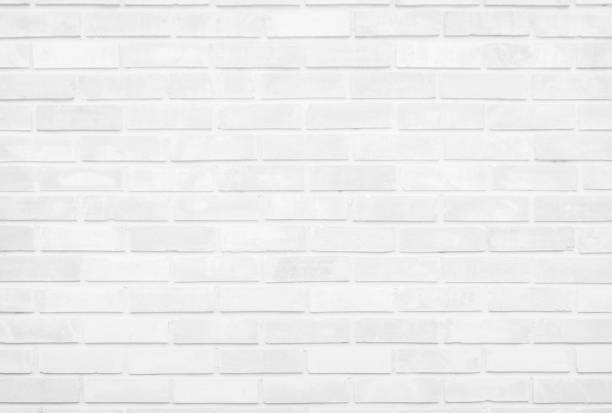 istock White brick wall texture background in room at subway. Brickwork stonework interior, rock old concrete grid uneven abstract weathered grey clean tile design, horizontal architecture wallpaper. 1283677287