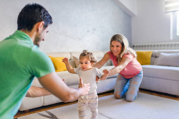 istock First steps of our baby 1283677635