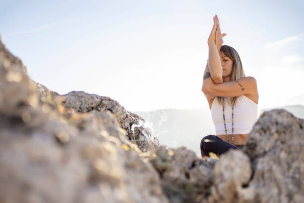 istock Woman practicing yoga in peaceful outdoor environment 1283678734