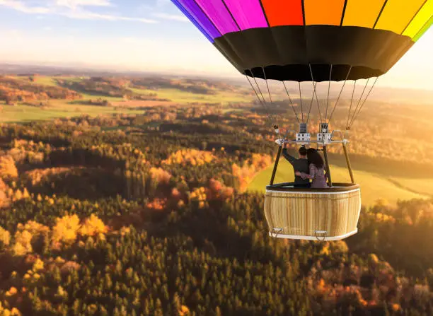 Aerial view of a European landscape from a hot air balloon with a loving couple, 3d render with photo element.