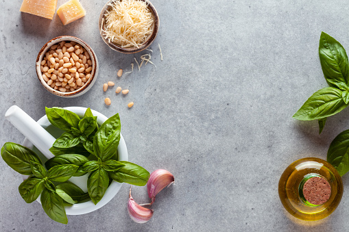 Top view of pesto ingredients on table. Copy space