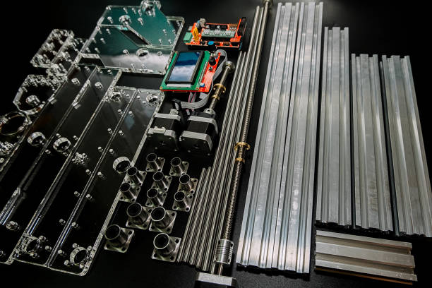 istock a set of parts for a laser machine on a black background, silver backlight, flat lay open-source hardware and software board for controlling the machine and v slot aluminum profile lies 1283680655