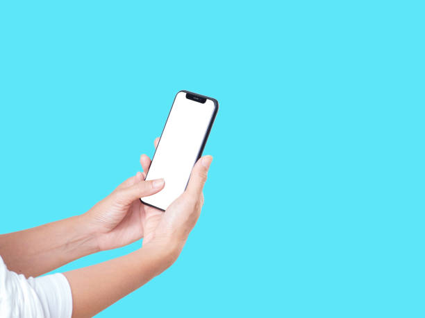istock Woman hand holding smartphone on red background 1283680762