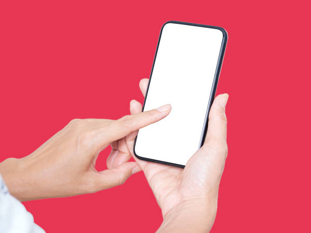 istock Woman hand holding smartphone on red background 1283680845