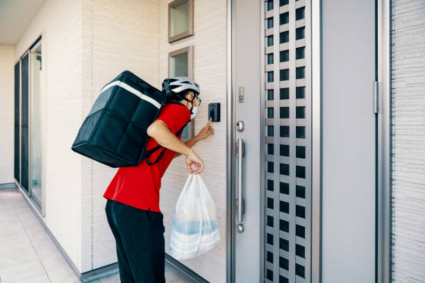 istock Man delivering food by bicycle during a global pandemic 1283681655