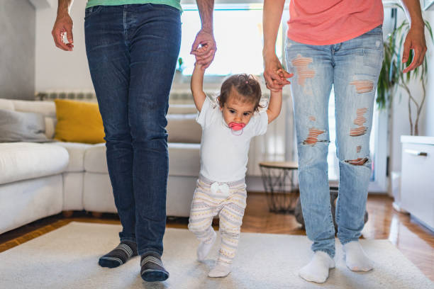 istock First steps of our baby 1283681748