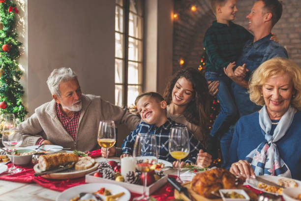 istock Family gathered for Christmas dinner 1283682117
