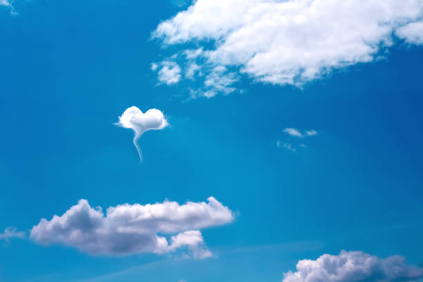 istock White cloud in heart shaped on bright blue sky background 1283682177
