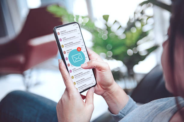 istock Female recieve inbox view the pending e-mail communication at home, New messages on mobile smartphone. 1283682261