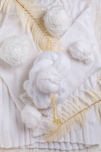 istock Knitting concept with needles, wool, sweater and yarn 1283683186