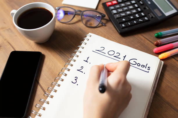 istock New Year's Solution Goal List 2021. Handwritten notebook about New Year's goals and resolutions plan list. 1283685200