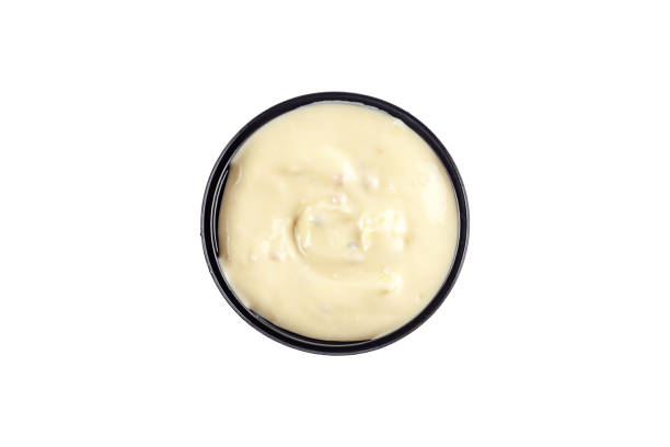 istock Sauce tartar in a plastic disposable dish on a white background, top view. Isolated 1283685402