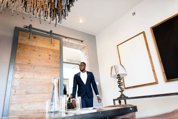 istock Young African businessman entering conference room 1283685986