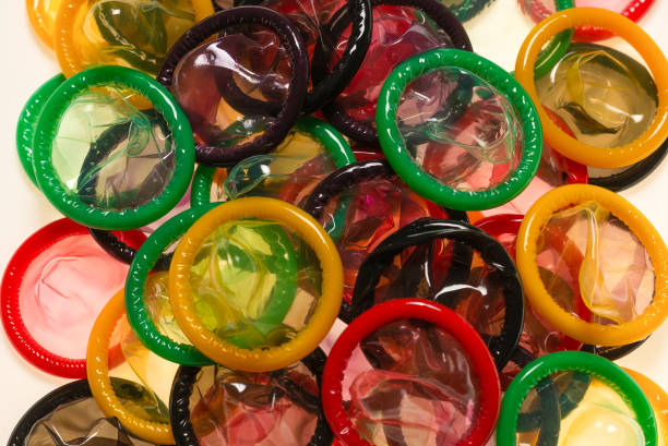 istock Colorful condoms background. 1283686891