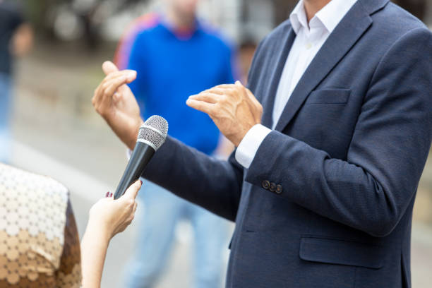 istock Journalist making media interview with unrecognizable person. Vox populi concept. 1283688464