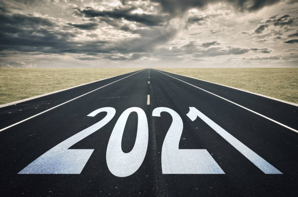 istock 2021 Road perspective, dark clouds, crisis concept 1283690800