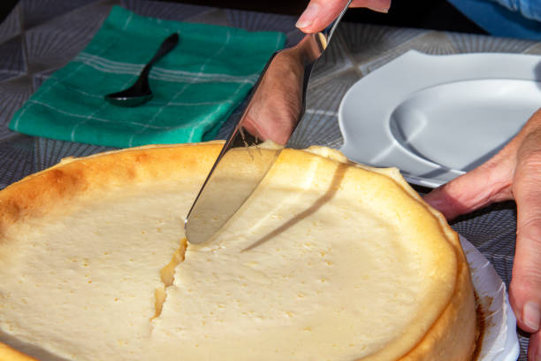 istock Cutting a homemade cheesecake 1283694073
