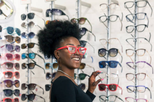istock Young customer choosing eyeglasses in store 1283694159