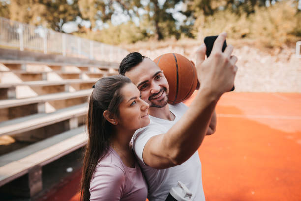 istock Basketball couple taking selfie 1283694435