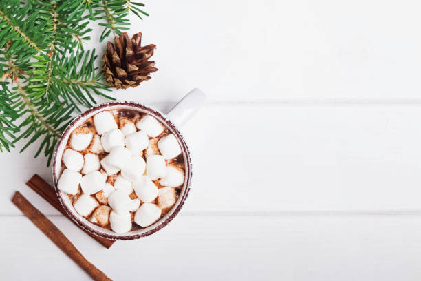 istock Hot cocoa with marshmallows in the cup on the white background 1283694613