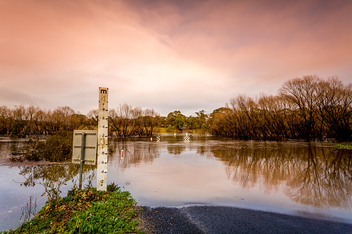 Road cut by flood waters of the Wollondilly River, the water level at 2 metres, but it rose to 4 metres in total and all signs were under water