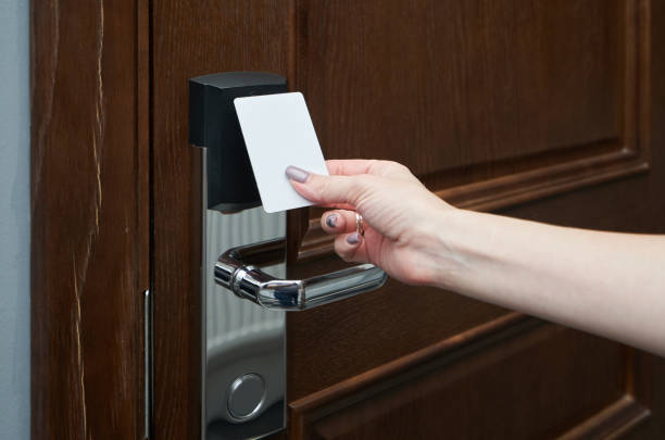 istock Woman opens the door in the hotel using a key card 1283695363