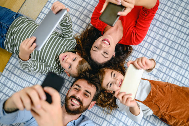istock Family using mobile phones together 1283696185