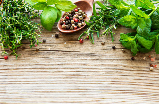 istock Fresh herbs and spices on wooden background top view 1283696249