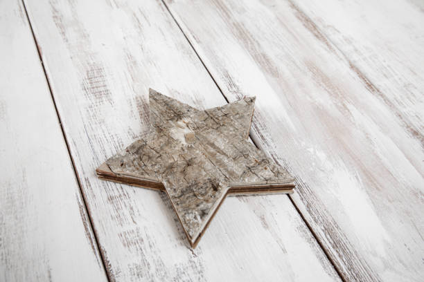 Painted wood surface with stars made of wood placed on the surface