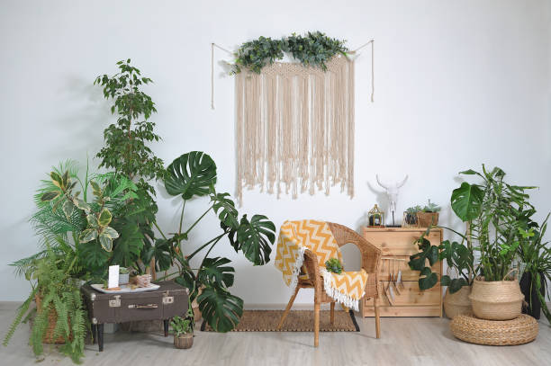 istock Home cozy interior in boho style, decor and indoor flowers 1283696577