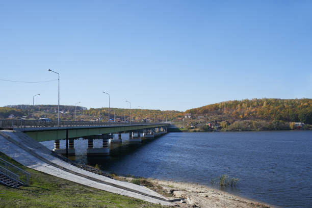 istock Modern bridge over the river for transport 1283696660