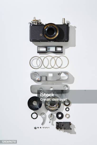 Flat Lay Top View Of Parts And Components Of A Disassembled Vintage Film Camera Stock Photo - Download Image Now