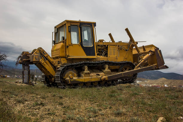 istock Big yellow bulldozer road works 1283697695