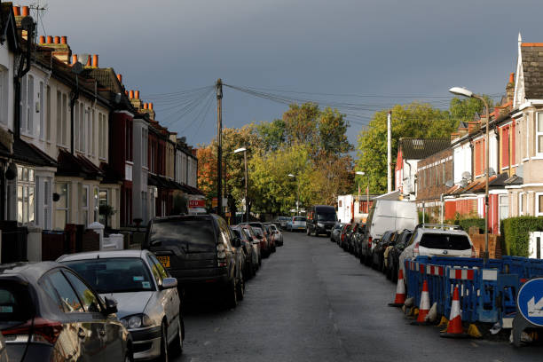 istock Black rain clouds over sunlit street in Merton England 1283697740