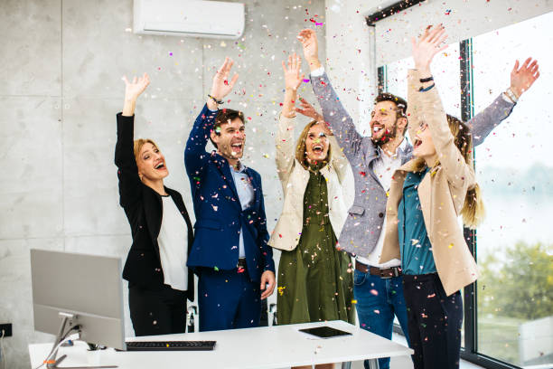 istock Business people celebrating inside modern office 1283698859