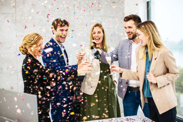 business people celebrating inside modern office - party business toast champagne imagens e fotografias de stock