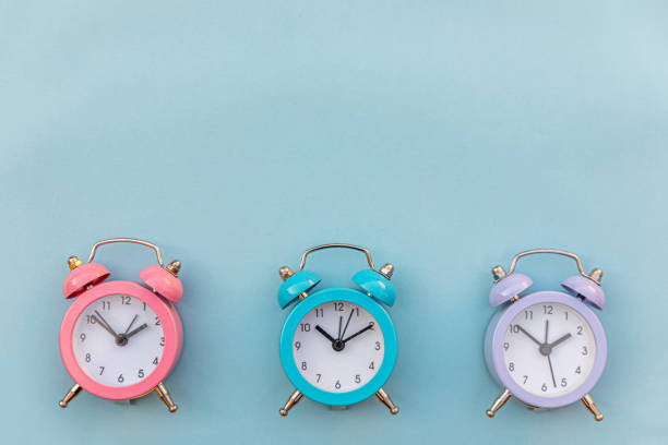 Simply minimal design three ringing twin bell classic alarm clock Isolated on blue pastel background. Rest hours time of life good morning night wake up awake concept. Flat lay top view copy space