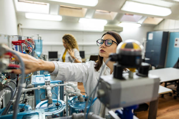 istock Beautiful female engineer works in laboratory 1283700848